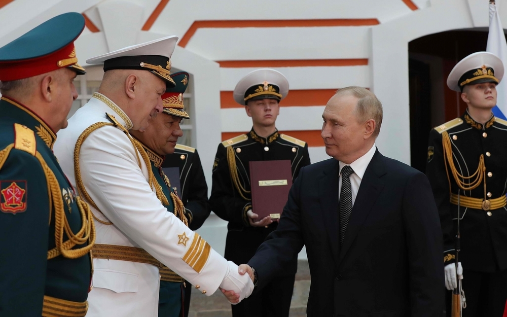 President Vladimir Putin with his military personnel
